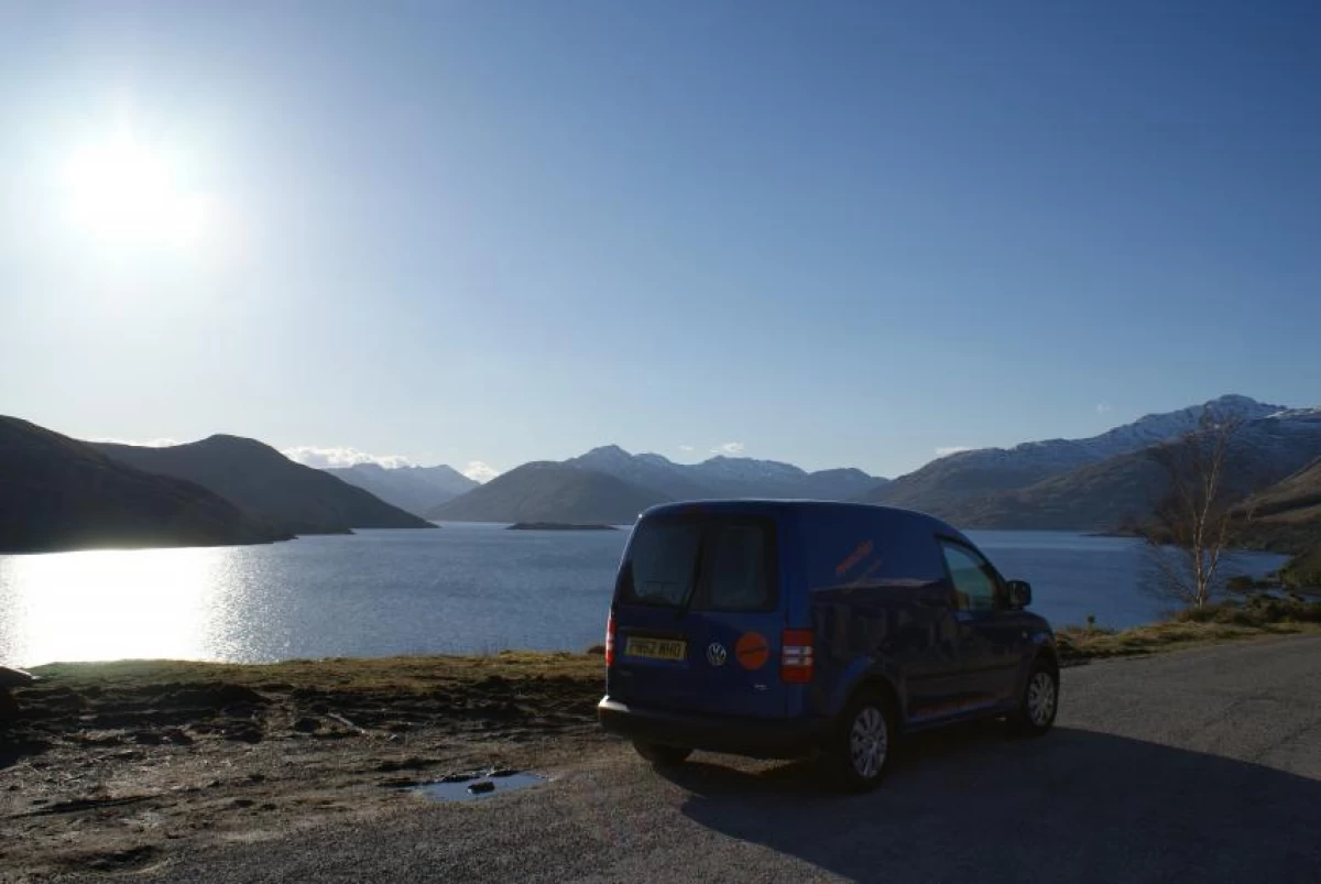 A Spaceships Camper Car parked by a Loch in Scotland