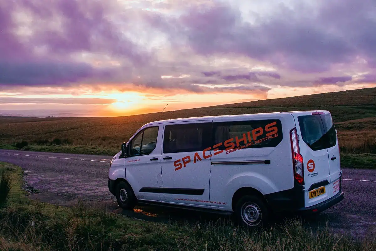 Ford Transit Mini Bus - side view, sun setting in background